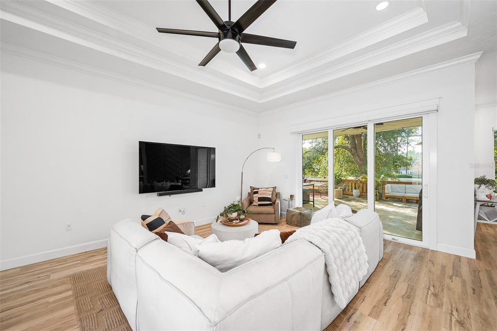 1068 Southwest 120th Drive Gainesville, FL 32607 - Photo 10 of 43 a living room with furniture and a flat screen tv