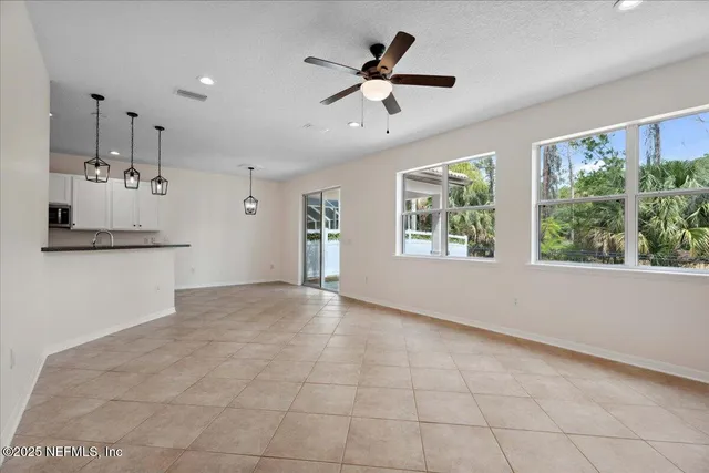 a view of empty room with windows