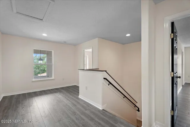 a view of a bathroom from a hallway