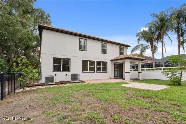 an aerial view of a house with yard swimming pool and outdoor seating