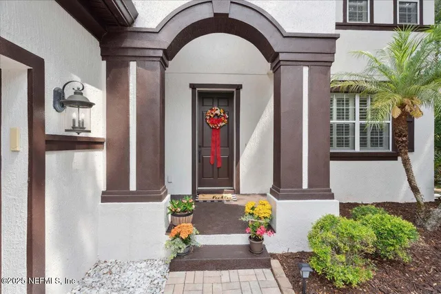 a view of entryway and hall with a window