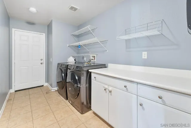 a utility room with cabinets