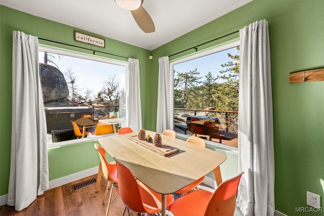 33334 Bear Road Running Springs, CA 92382 - Photo 19 of 37 a view of a dining room with furniture window and outside view