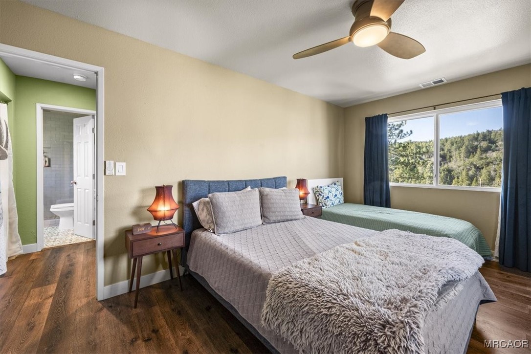 33334 Bear Road Running Springs, CA 92382 - Photo 25 of 37 a bedroom with a bed and a window