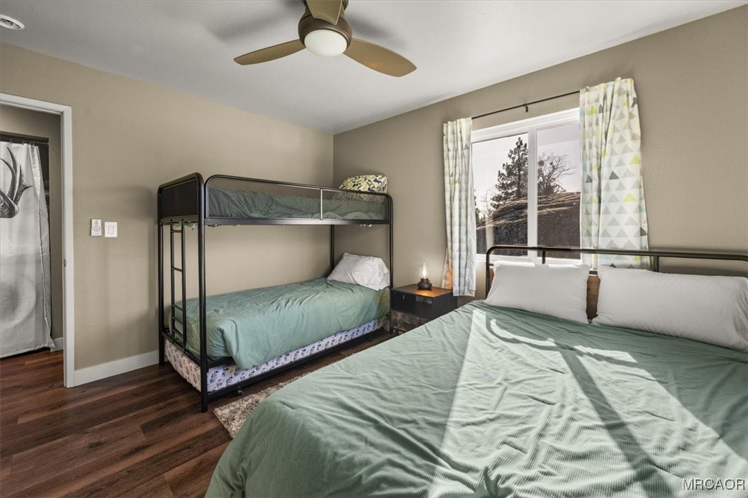 33334 Bear Road Running Springs, CA 92382 - Photo 28 of 37 a bedroom with double bed and a large window