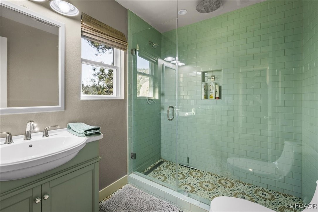 33334 Bear Road Running Springs, CA 92382 - Photo 30 of 37 a bathroom with a sink and a mirror