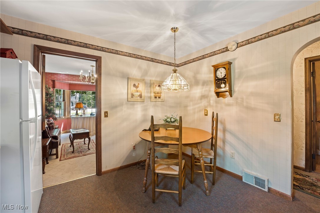 3602 Darrow Road Stow, OH 44224 - Photo 16 of 26 Carpeted dining space with a chandelier