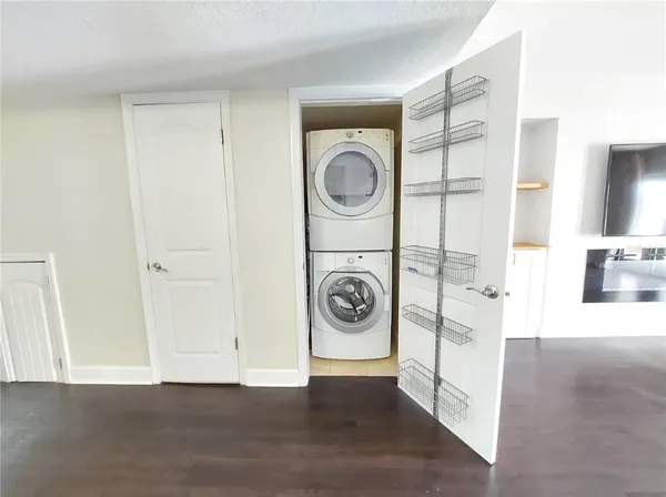 a view of a hallway with washer and dryer
