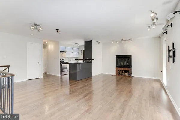a view of kitchen with furniture and wooden floor
