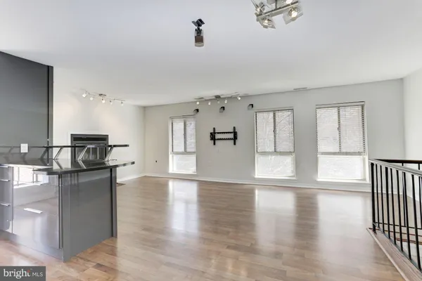 a view of kitchen with furniture and wooden floor