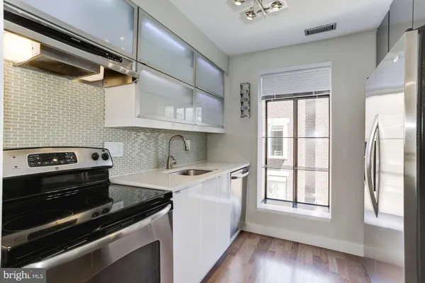 a kitchen with a stove and a microwave