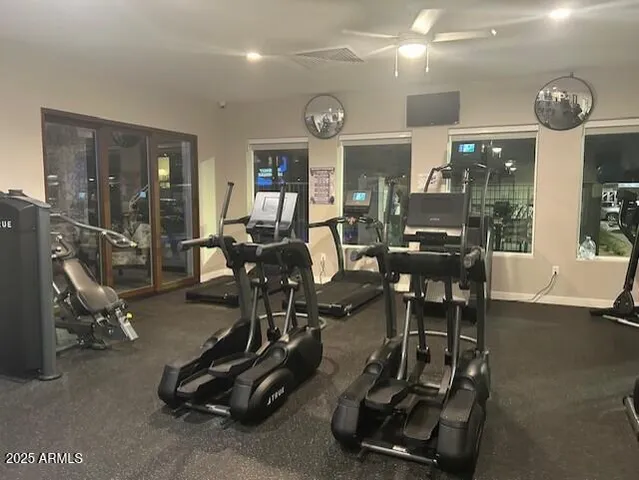 a room with pool table and chairs