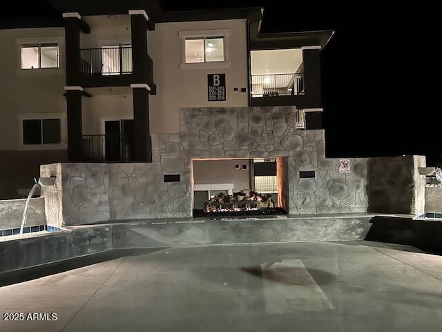 8683 East Commons Circle, Unit A313 Prescott Valley, AZ 86314 - Photo 17 of 17 a kitchen with a sink and a fireplace