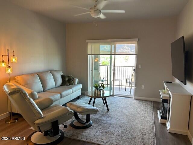 8683 East Commons Circle, Unit A313 Prescott Valley, AZ 86314 - Photo 3 of 17 a living room with furniture and a flat screen tv