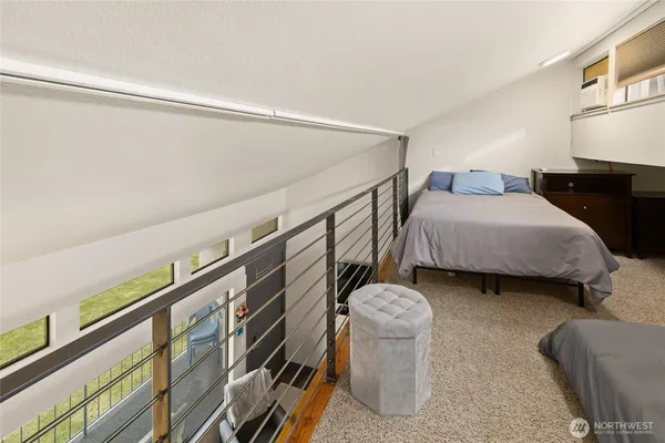 a bedroom with bed and a chandelier