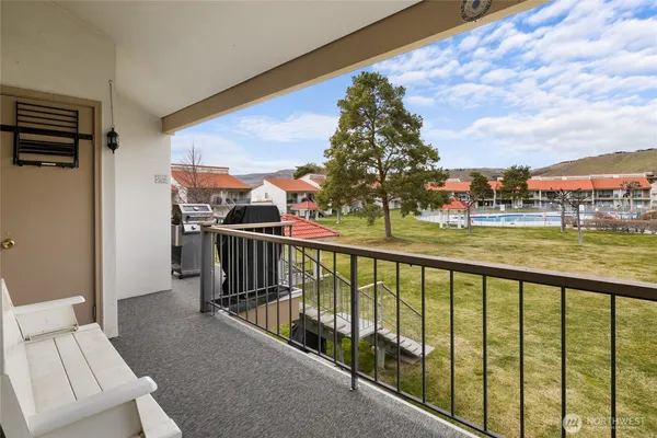 a view of balcony with furniture