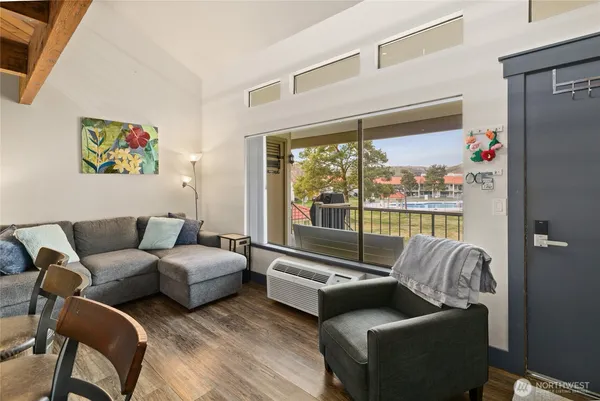 a living room with furniture and a large window