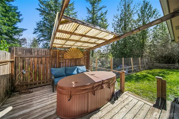 a view of a wooden deck and outdoor seating