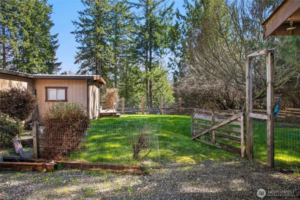 a view of backyard with swimming pool