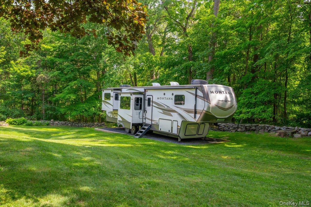 13 Jacks Pond Road Newburgh, NY 12550 - Photo 40 of 44 Travelers and outdoor enthusiasts will appreciate the professionally graded RV pad, complete with a dedicated 50-amp electrical hookup.