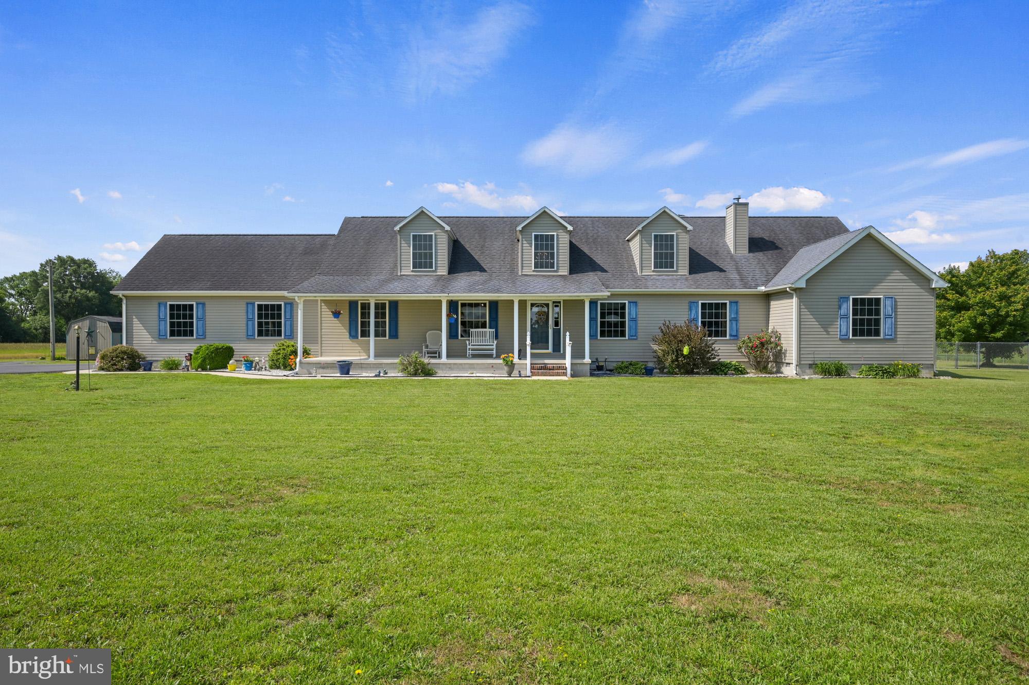 480 Hemping Road Harrington, DE 19952 - Photo 1 of 40 a front view of a house with a garden
