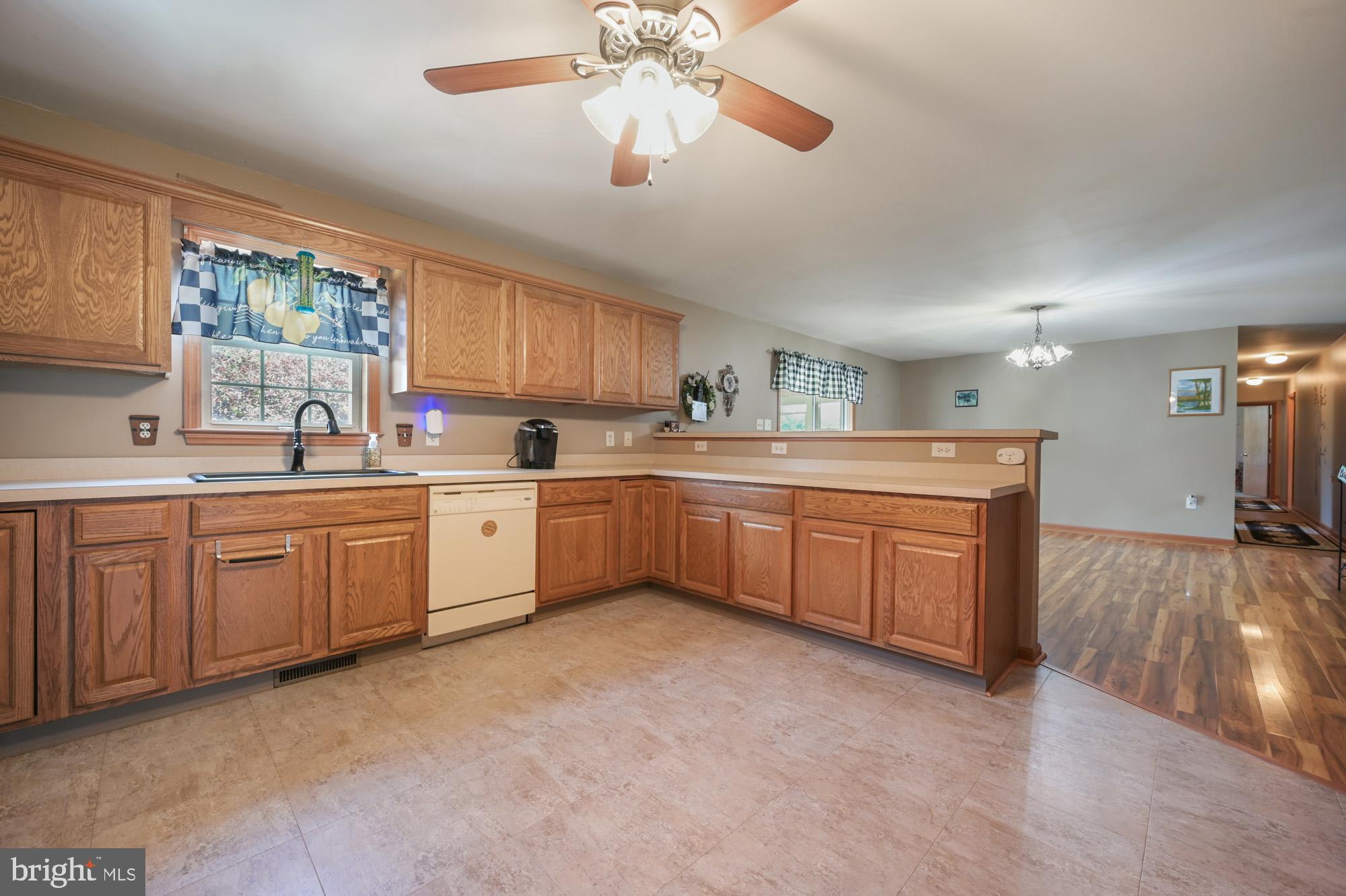 480 Hemping Road Harrington, DE 19952 - Photo 19 of 40 a kitchen with a sink cabinets and window