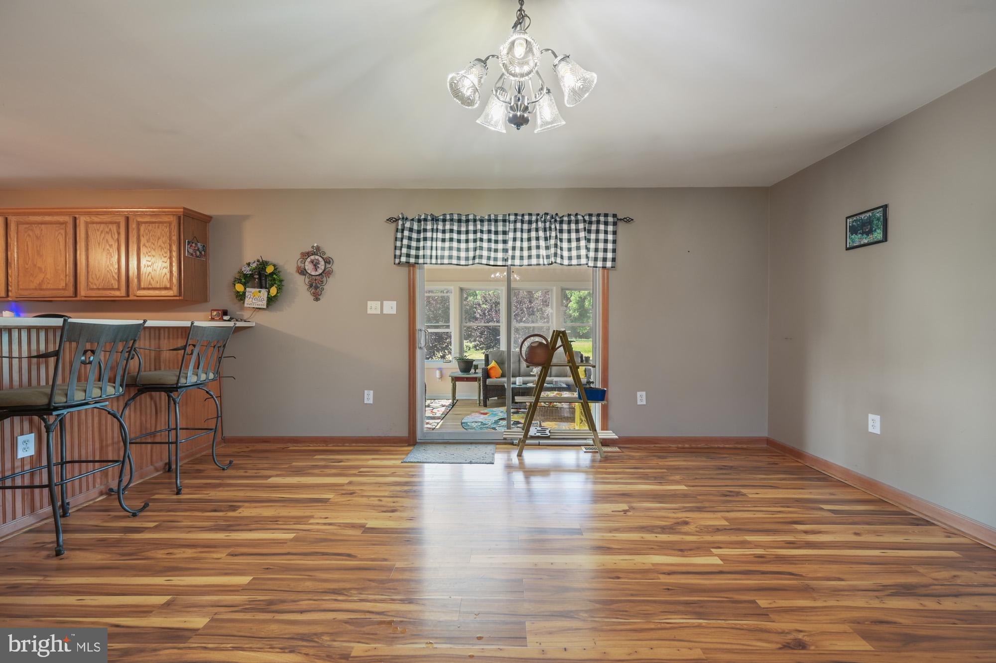 480 Hemping Road Harrington, DE 19952 - Photo 26 of 40 a view of a livingroom with furniture wooden floor and windows