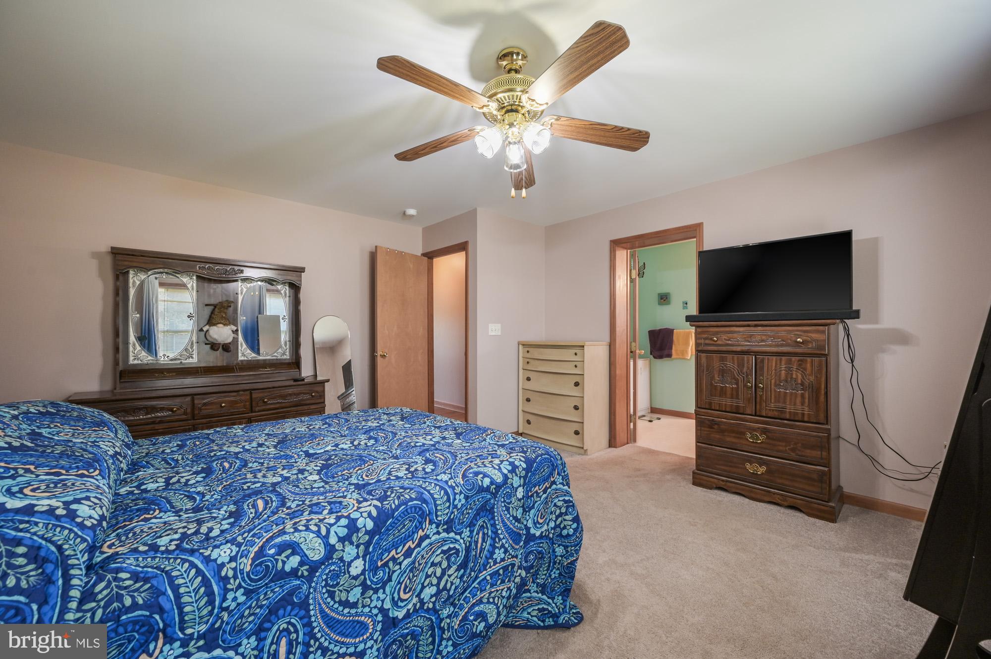 480 Hemping Road Harrington, DE 19952 - Photo 30 of 40 a bedroom with a bed and a flat screen tv