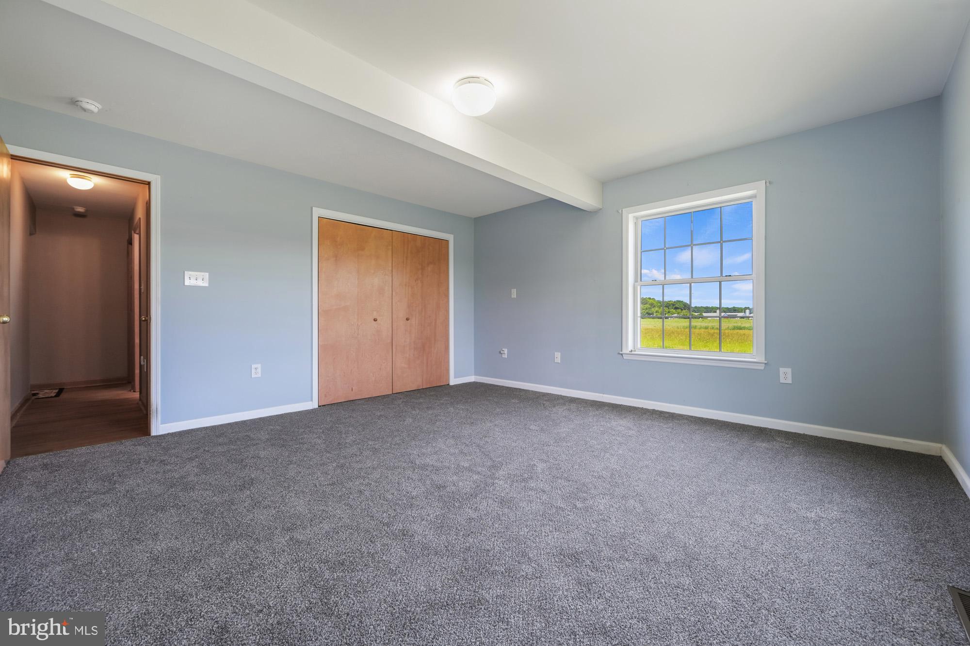 480 Hemping Road Harrington, DE 19952 - Photo 34 of 40 an empty room with windows and mirror