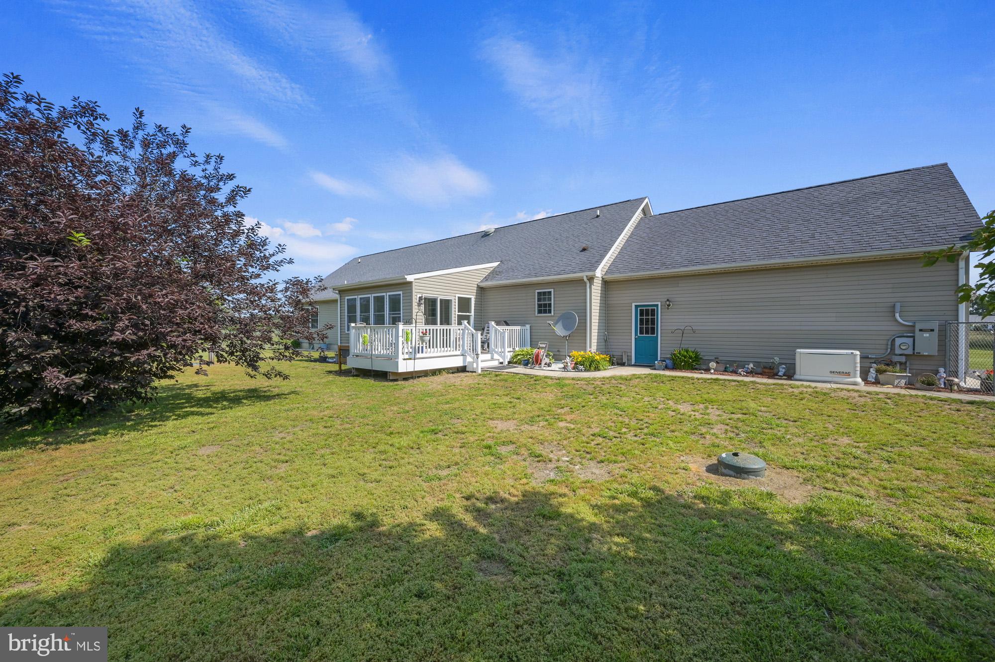 480 Hemping Road Harrington, DE 19952 - Photo 4 of 40 a front view of a house with swimming pool having outdoor seating