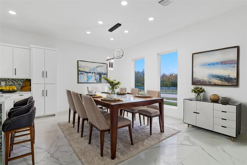 9726 Sunset Drive Frisco, TX 75033 - Photo 3 of 12 a view of a dining room with furniture and window