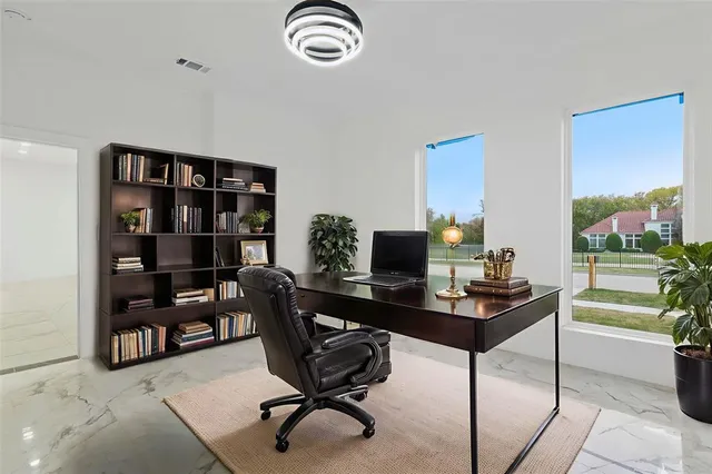 a view of a workspace with a bookshelf