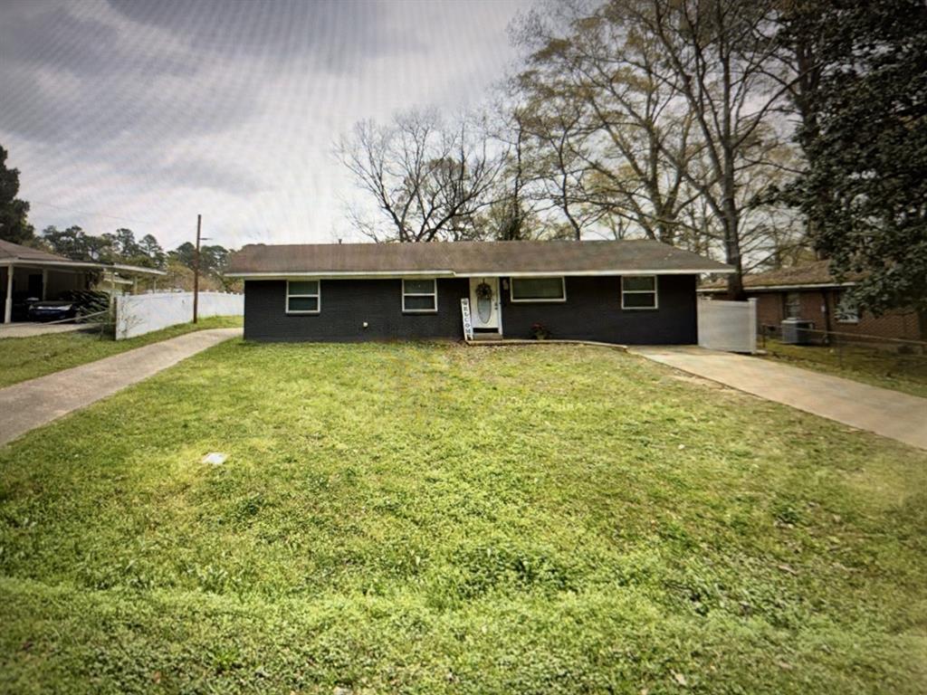 1810 Lexington Street Ruston, LA 71270 - Photo 9 of 9 a backyard of a house with yard and garage
