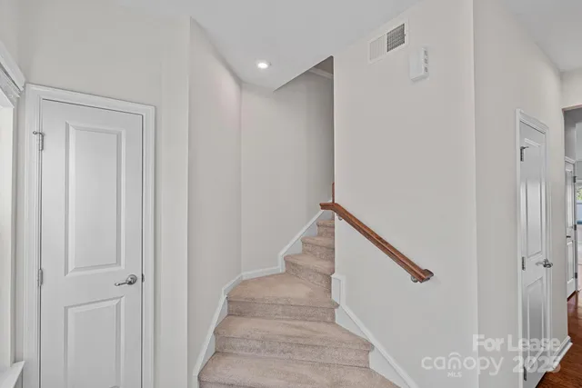 a view of staircase with white walls and white walls