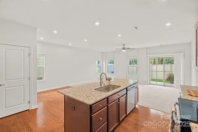 a kitchen with a sink and cabinet
