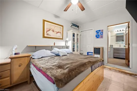 a bedroom with a bed and a fireplace