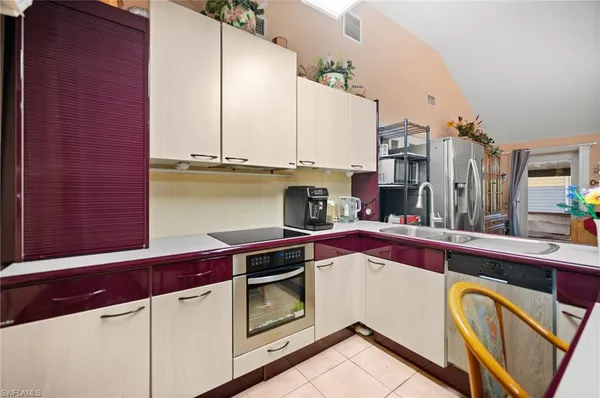 a kitchen with stainless steel appliances a stove and cabinets