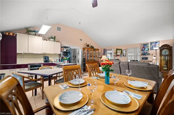 a dining room with furniture and wooden floor