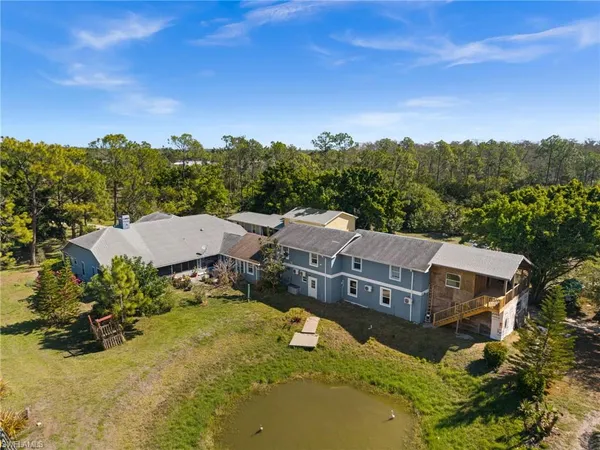 a view of a house with a big yard