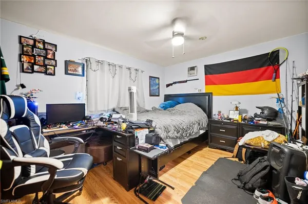 a bedroom with a bed and a desk