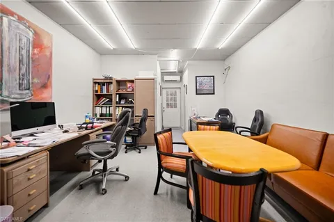 a view of a workspace with furniture