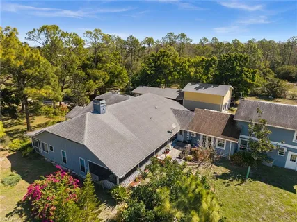 an aerial view of a house having yard