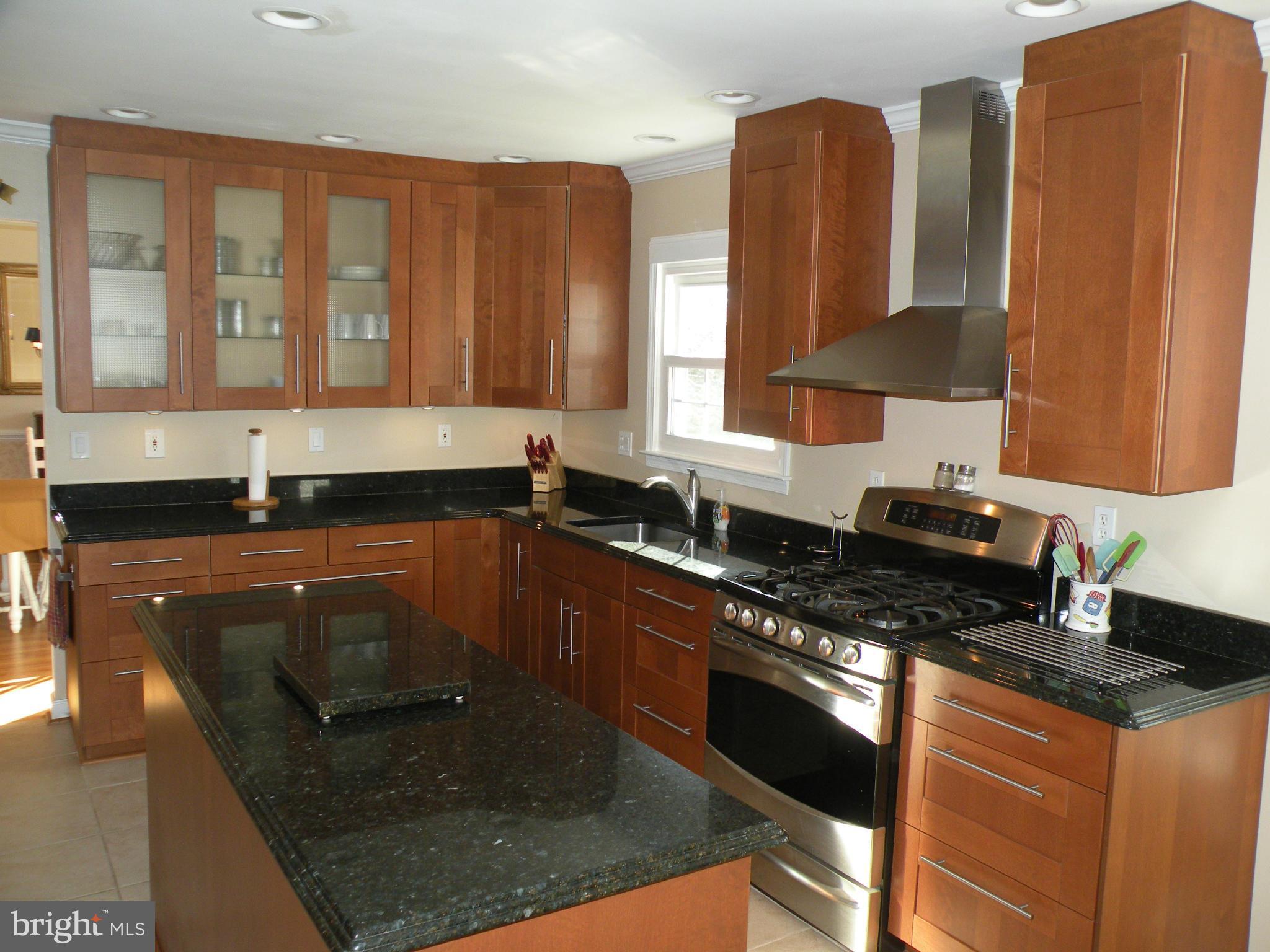 3231 Breckenridge Way Riva, MD 21140 - Photo 11 of 30 a kitchen with granite countertop a sink a stove and cabinets
