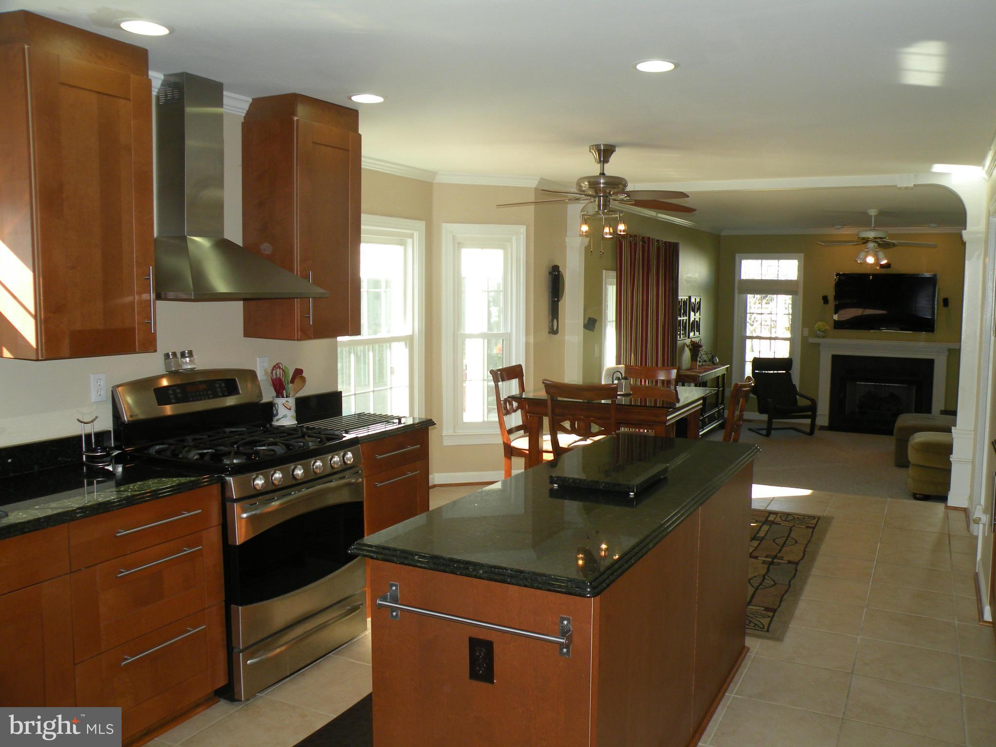 3231 Breckenridge Way Riva, MD 21140 - Photo 12 of 30 a kitchen with kitchen island granite countertop a stove and a sink