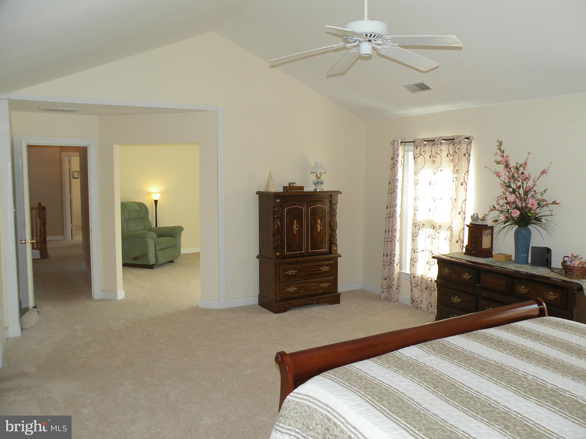 3231 Breckenridge Way Riva, MD 21140 - Photo 14 of 30 a bedroom with a bed and a chandelier