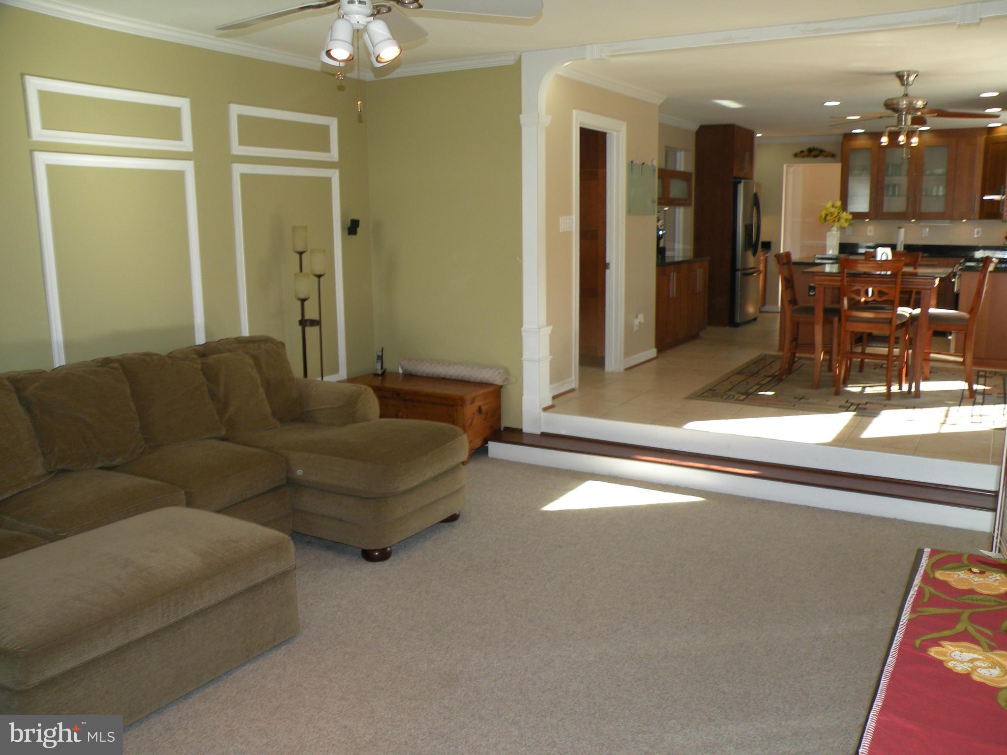 3231 Breckenridge Way Riva, MD 21140 - Photo 22 of 30 a living room with furniture and a dining table with kitchen view