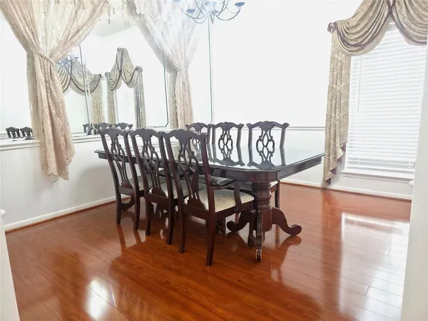 a view of an entryway with wooden floor