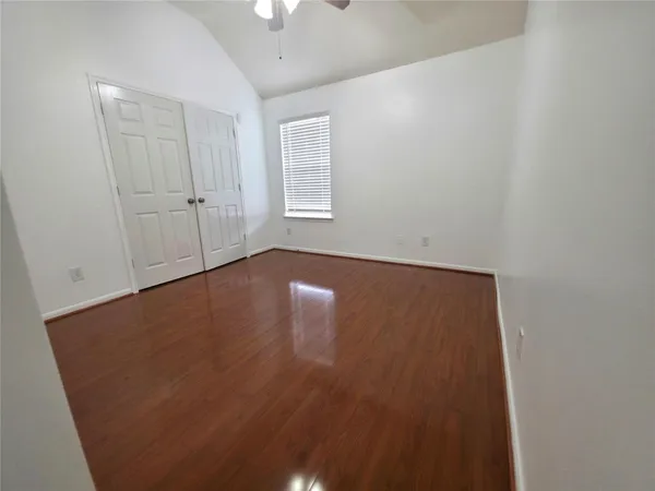 a spacious bathroom with a sink a vanity and a mirror