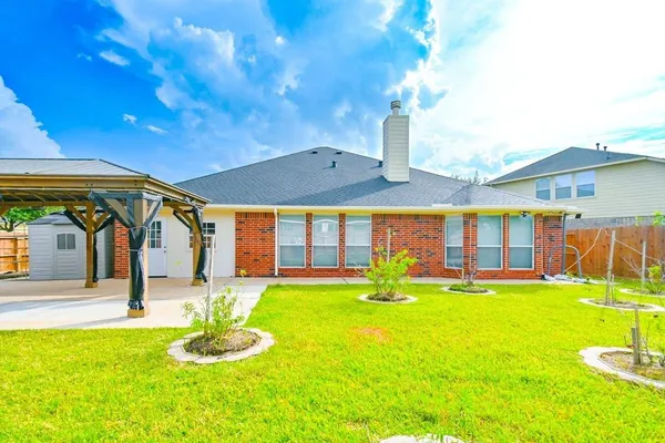 a front view of house with yard and patio