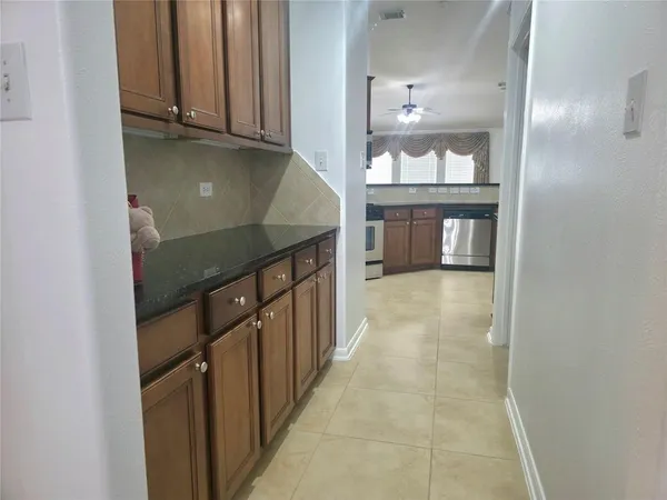 a kitchen with stainless steel appliances a stove a microwave and a refrigerator